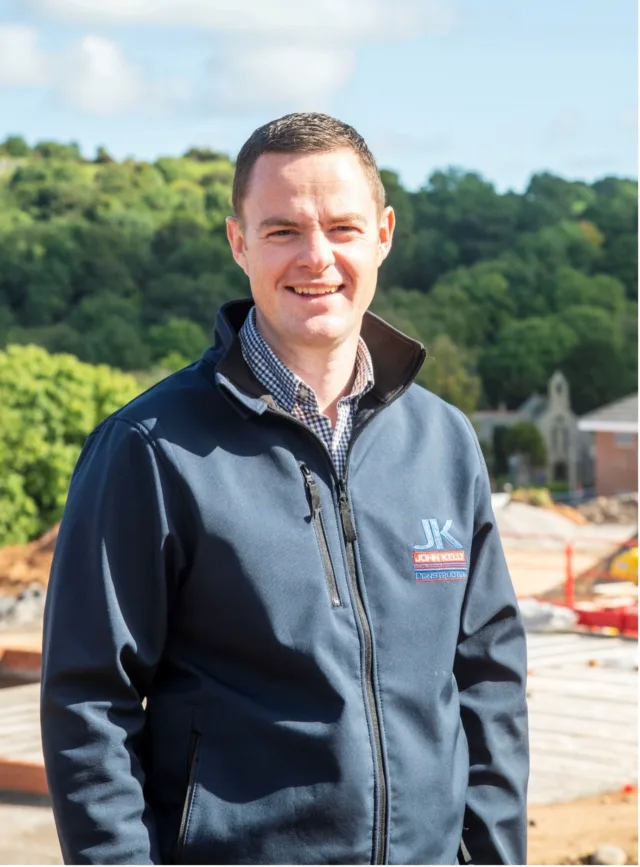 Photograph of Martin, our business manager, on site wearing a JK Construction fleece.